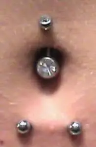 Horizontal bottom and top double navel piercing